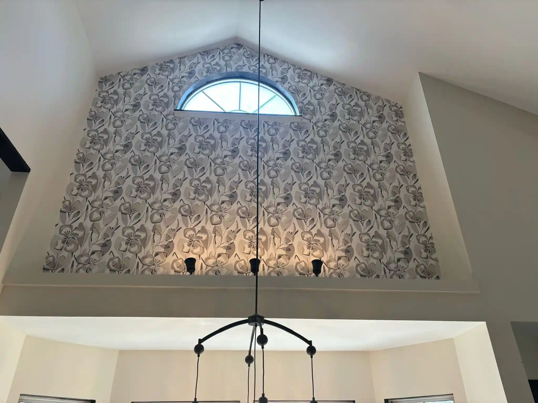 Professional wallpaper installer at work in San Diego